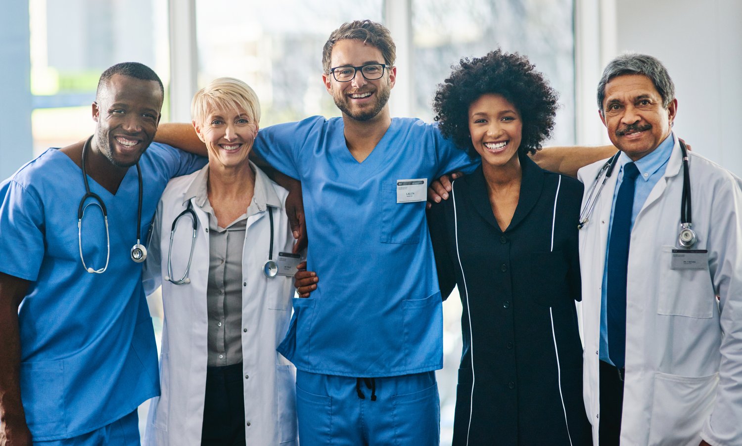 The kind of camaraderie youd want in a medical team. Portrait of a diverse team of doctors standing together in a hospital